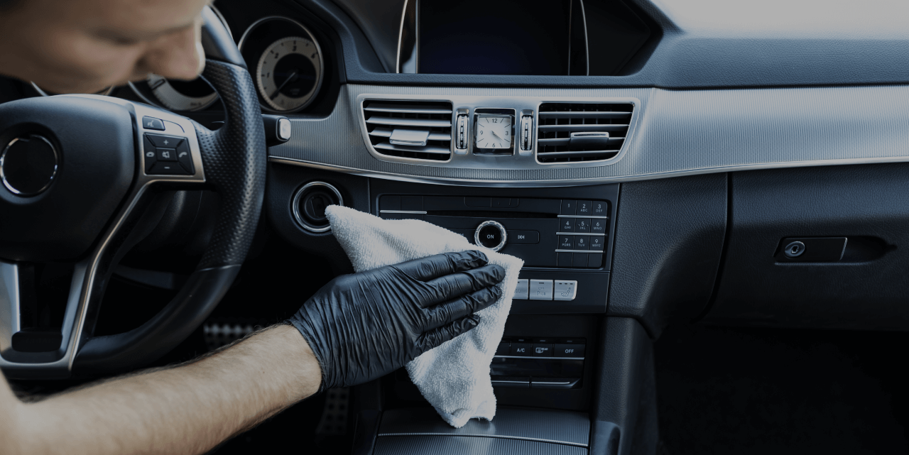 Man cleaning car interior